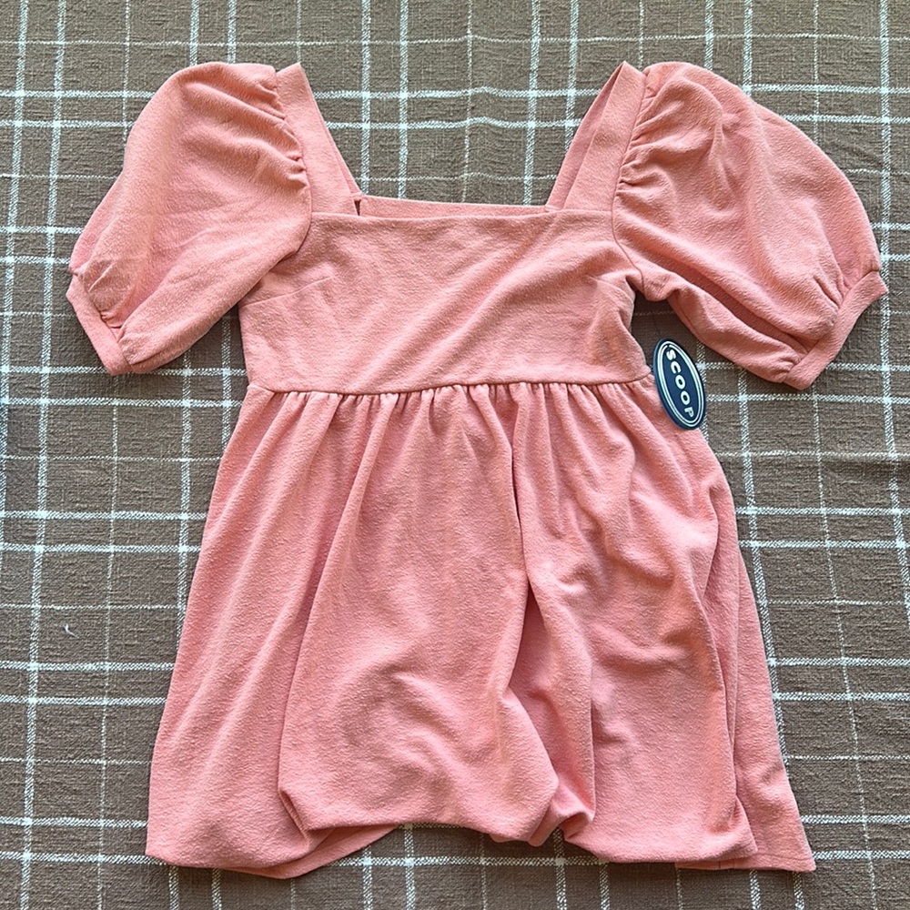 Scoop Babydoll Dress with balloon sleeves, a square neckline and swing skirt.